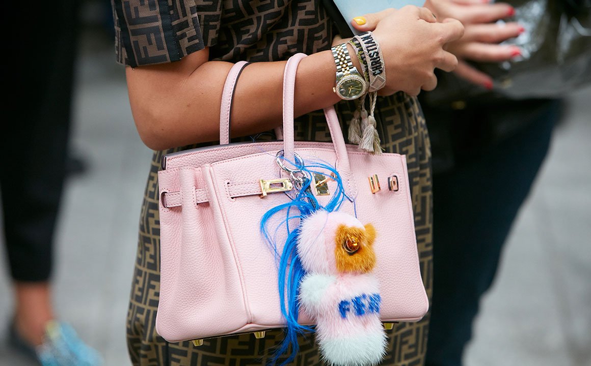 milan, italy september 19, 2019: woman with pink leather bag w